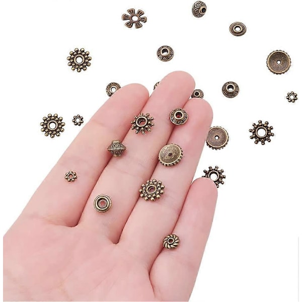 500 st 10 Stilar Tibetansk Legering Antik Brons Distanspärlor Växel Bicone Blomma Metall Distanspärlor för Armband Halsband Smyckestillverkning