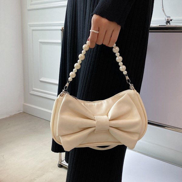 Liten messengerbag i skinn for kvinner, lett og stilig