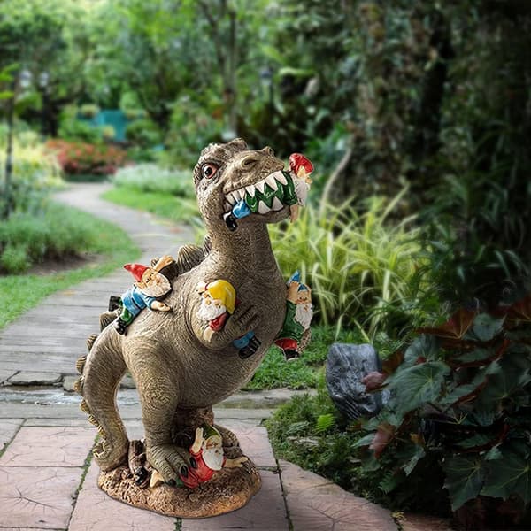 Dinosaur der spiser havegnom-statue, havegnom og dinosaurlegetøj