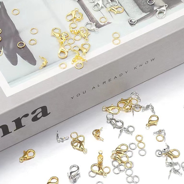 Hummerlåsset i guld + silver - Boxad