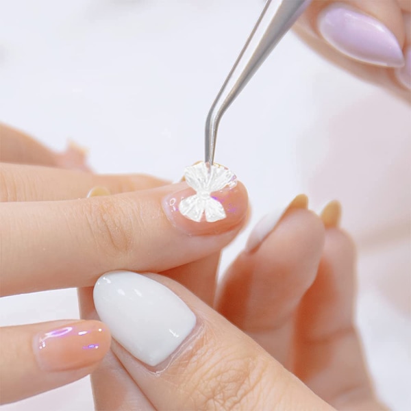 Hårspänne i harts med fjärilsrosett, nageldekorationer med fjärilsrosett