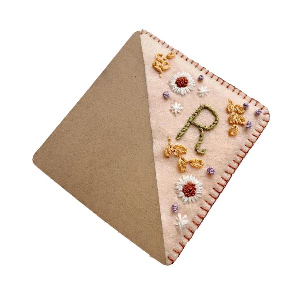 Personliga handbroderade hörnböcker, handsydda