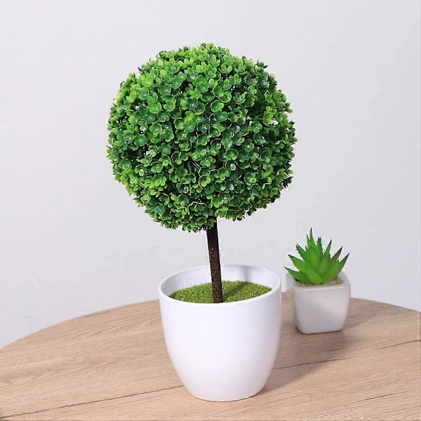 Sett med 2 små kunstige blomsterpotter i form av en topiary, i hvit keramikk