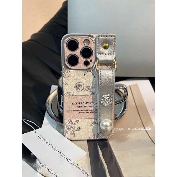 Kotelo iPhone 13 Pro Maxille, metallirengas galvanointi - ruusu + hopeinen kamelia rannekoru, temperamenttinen kamelia-aiheinen nahkakuvio