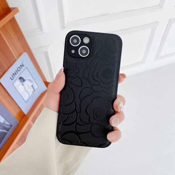 Fodral för iPhone 16 Plus svart lädertextur kamelia