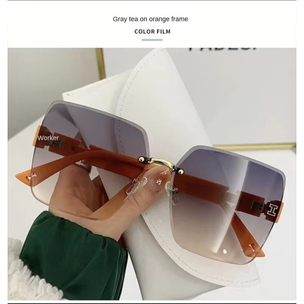 Trendiga kvinnliga båglösa solglasögon UV-skydd Modegradientfärg High Sense Street Shot-solglasögon Orange frame gray tea