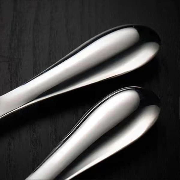 Serveringsskje for ris i rustfritt stål med ergonomisk non-stick overflate og tykt, solid håndtak