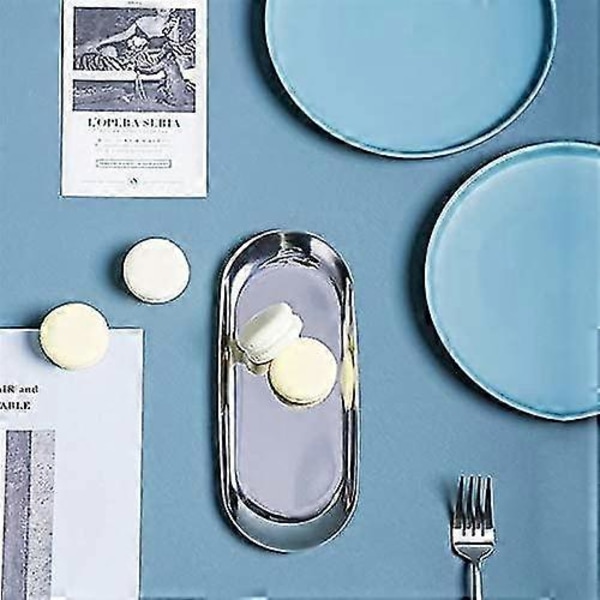 Set med 2 ovala brickor i silverfärgat rostfritt stål för förvaring av servetter, te och frukt