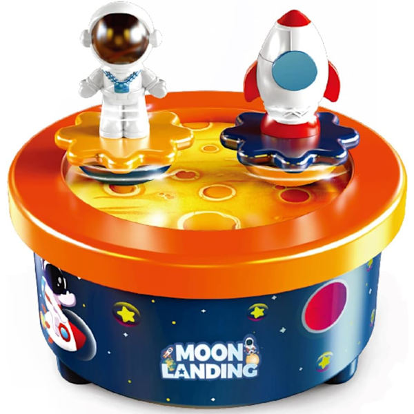 Kuu-aiheinen kakkukoriste, jossa on astronautti ja avaruusalus tanssivat hahmot ja Fly Me To The Moon -melodia