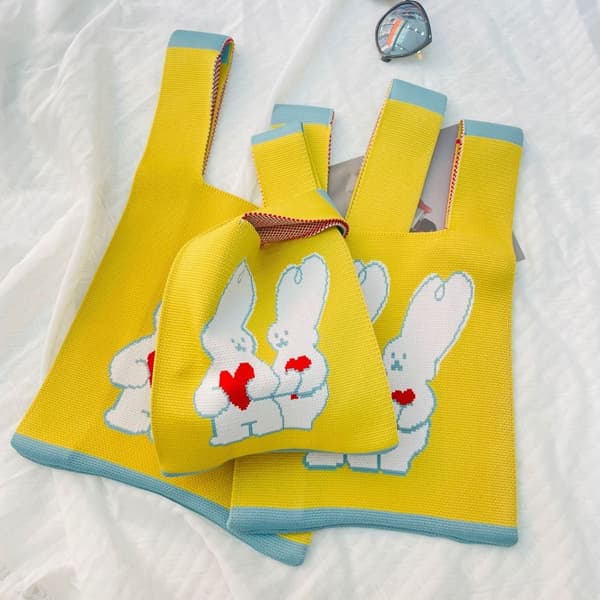 Stickad handväska Knot handledsväska GU yellow L