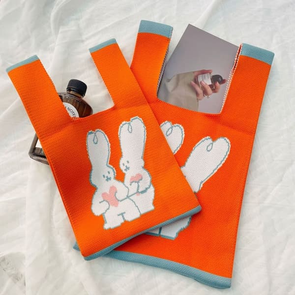 Stickad handväska Knot handledsväska ORANGE orange L