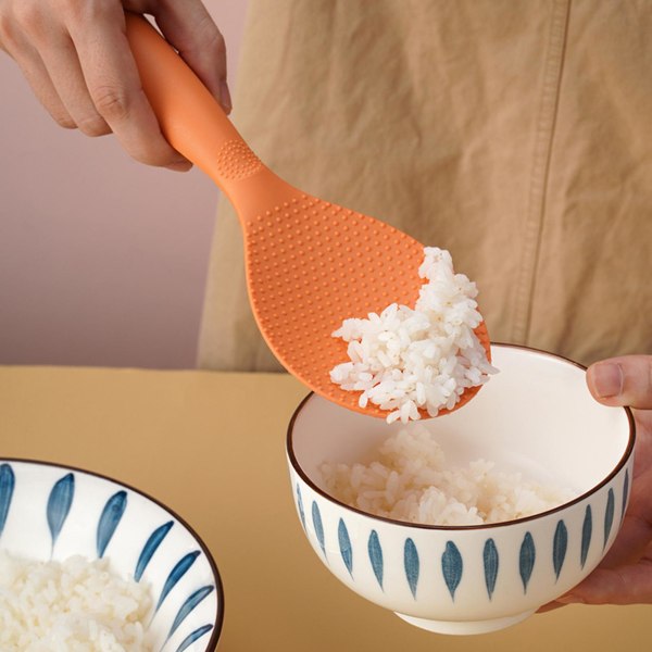 Riisilapio Monitoiminen tarttumaton pitkävartinen muovilusikka, jossa on tyhmyyssuunnittelu astiasto Ruokalaatuinen seisova riisiluikka liesi lastalla keittiötarvikkeet Orange
