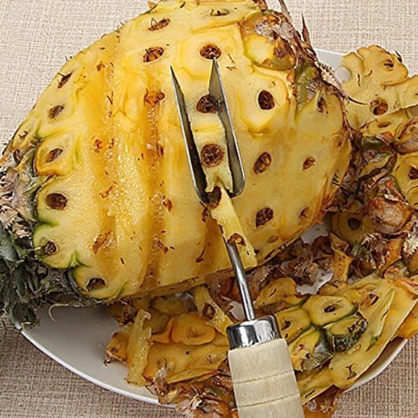 Ananaspelare i rostfritt stål, trähandtag triangulär ananas
