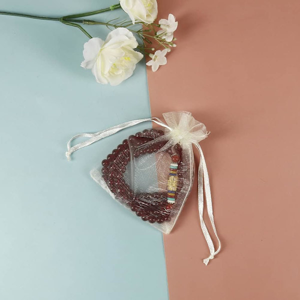 100 stk beige smykkesække med snøretræk af organza stof mini ca