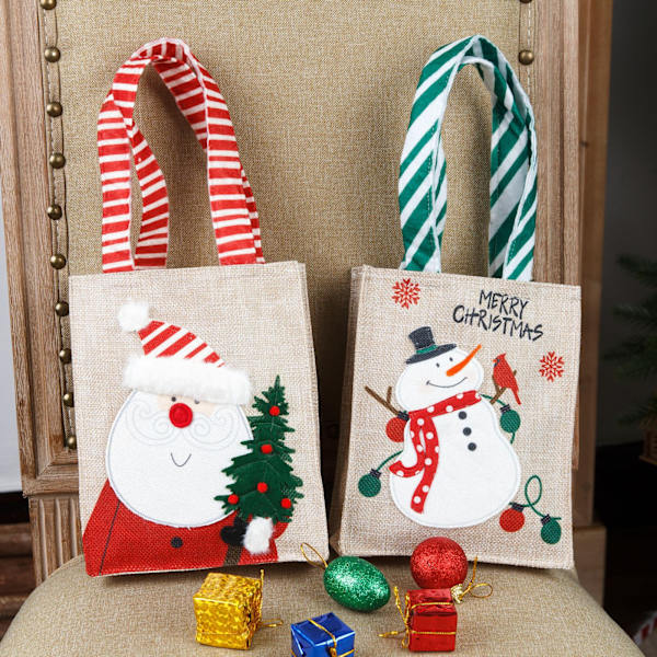 2 st bärbara julklappspåsar i canvas med gammal tecknad snöman