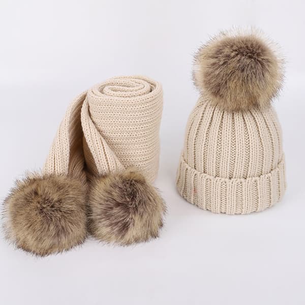 Spädbarns- och småbarnsmössa i ull, enfärgad, vintertwist med pompom