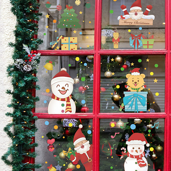2 tecknade jultomtar julgran snögubbe present glasfönster