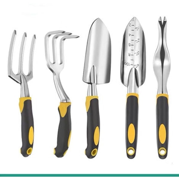 Liten spade och spade, kolstål rostfritt stål i trädgårdshuset, saftig grävjord, blomgrentranspl.