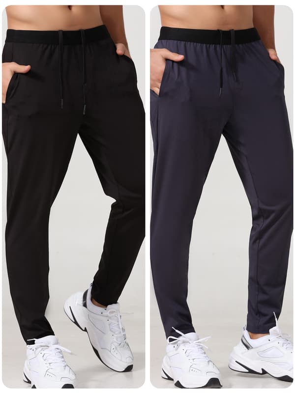 Joggebukse for menn med sidelommer og glidelås for løping og trening