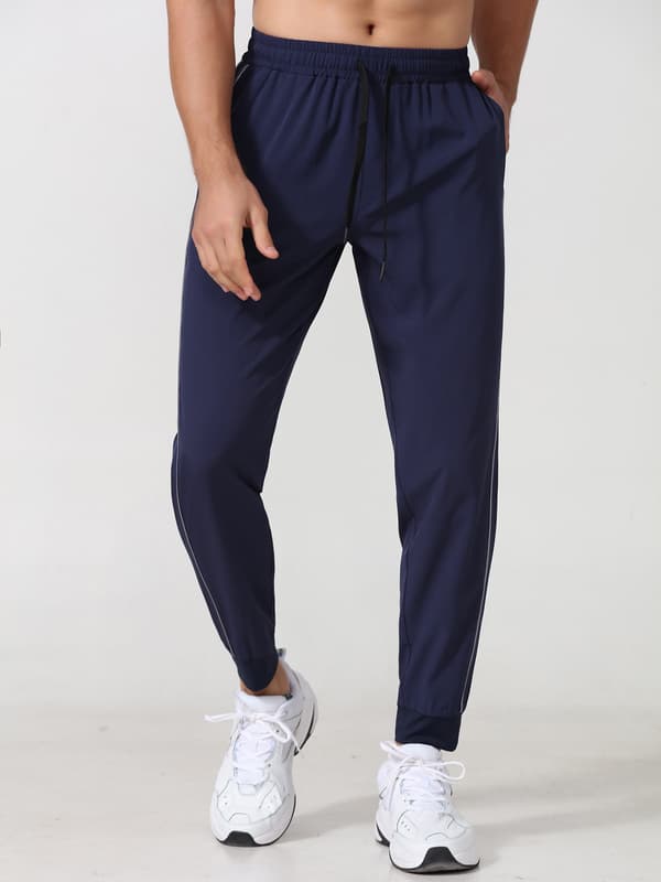 Joggebukse for menn med refleksstriper, lommer og elastisk linning for løping og trening