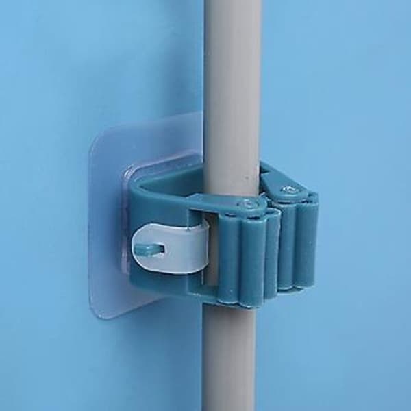 Wall-mounted mop holder, space-saving, with roller loop, drill-free mounting and reusable hanging clip.