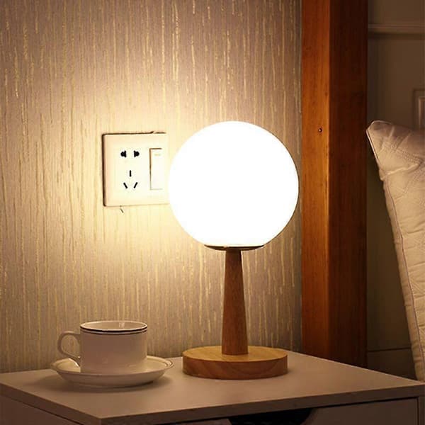Modern and minimalist spherical white glass table lamp