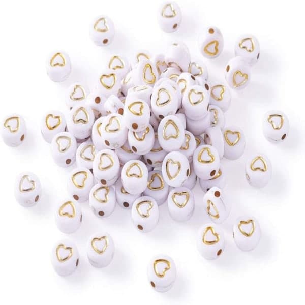 500 stk. 7x4 mm hvide akrylperler med guldhjerte ponyperle