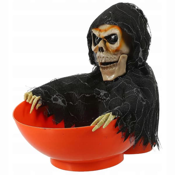 Halloween-dekorasjon med lysende skjelett godteriskål