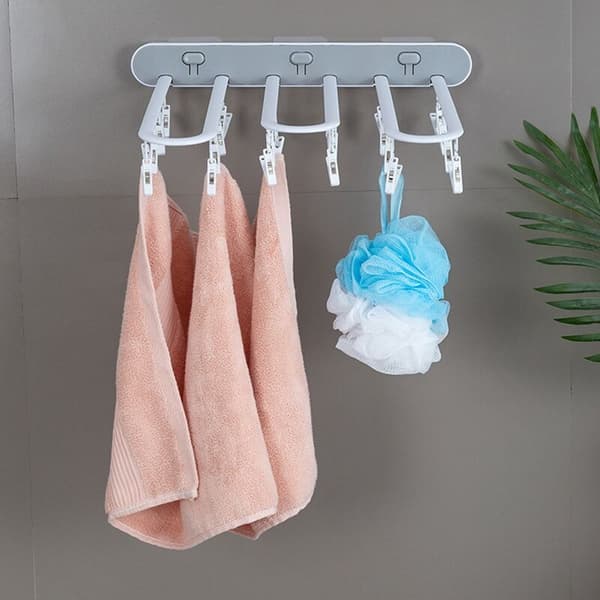 Sammenleggbar kleshenger i plast med flere klips, hvit + grå