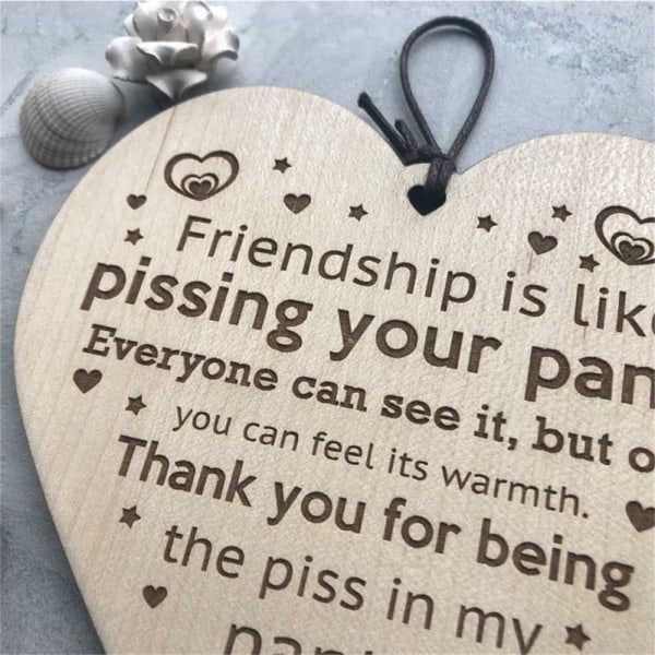 Friendship Pissing Pants Puinen plaketti
