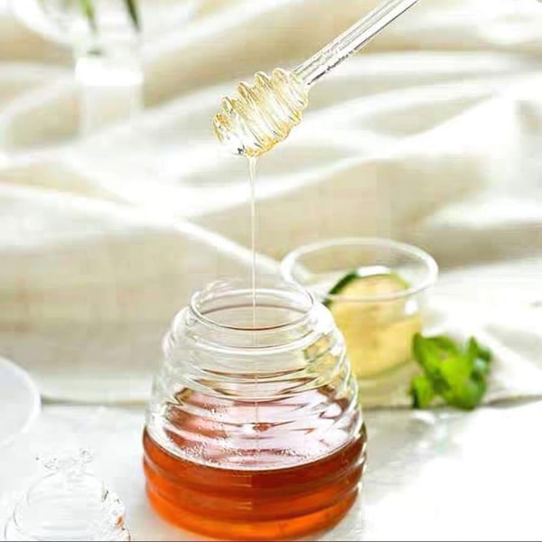 Honungsburk med kopp och lock Honungsförvaringstankar Glasbikupa