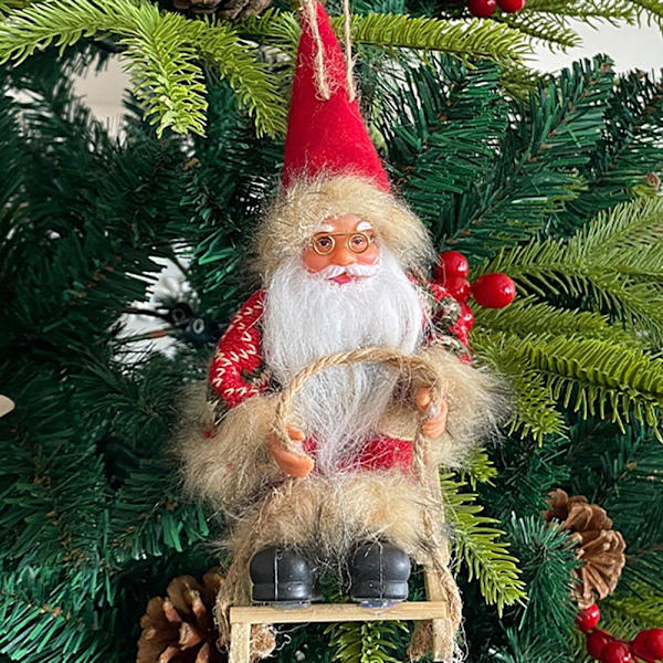 Sittende slede Julenissen juledukkefigurer 2 2 2