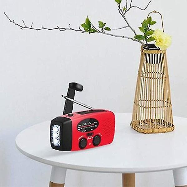Hätäradio/kampiradio aurinkokennoilla, taskulampulla ja virtapankilla
