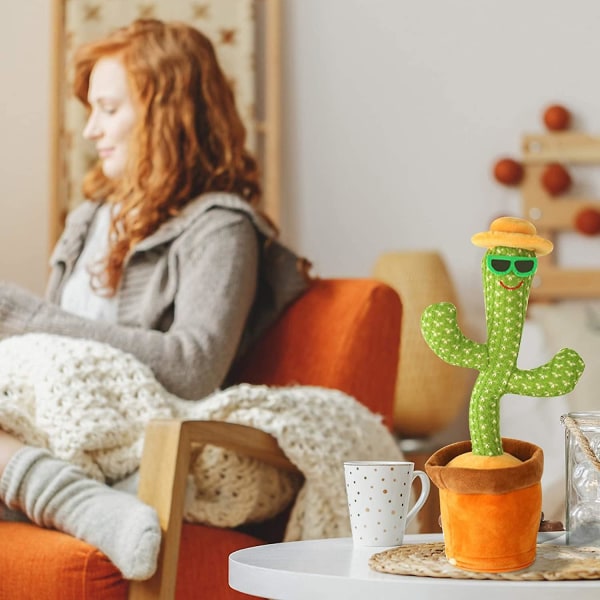 Den nya förtrollande, plyschiga plyschleksaken för dansande kaktus kan sjunga och vrida sig (kaktus med stråhatt)