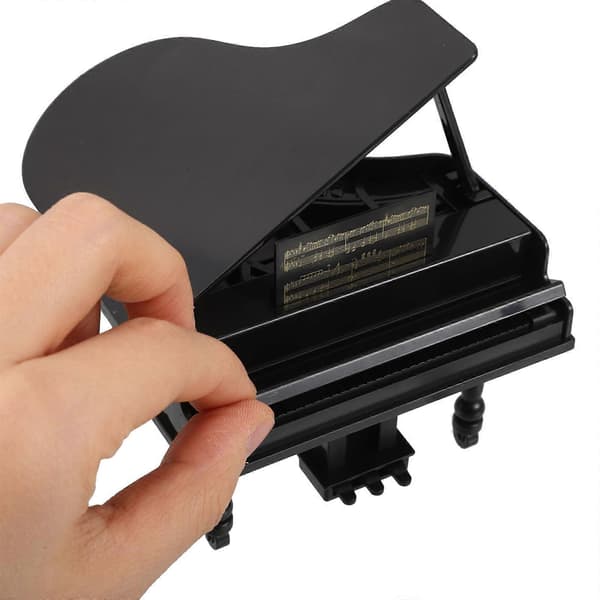 Miniatyr musikaliskt dockhuspiano och gitarrset för dekoration