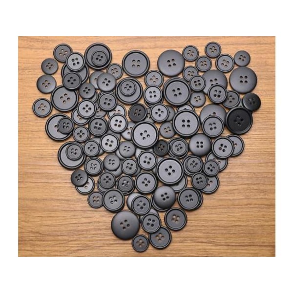 100 isoa mustaa ompelunappia (25 mm)