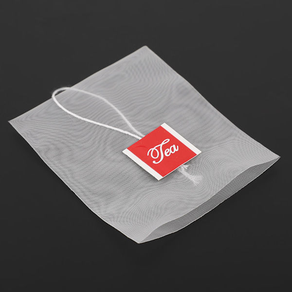 100 kpl Nylon Transparent tyhjiä teepusseja Yrttejä Sil Suodatin Löysä paperi nyörillä 6,5*8