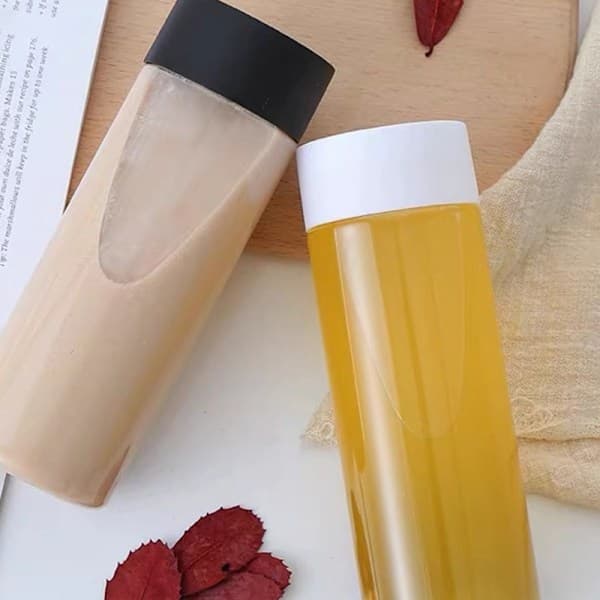 10 oz tomme plastikjuiceflasker med sorte låg - 12-pak