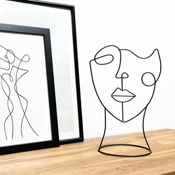 Moderne dekorativ figur: ansiktskunst med én strek | Svart dekorativ statue med minimalistisk design som en abstrakt dekorasjon for enhver leilighet