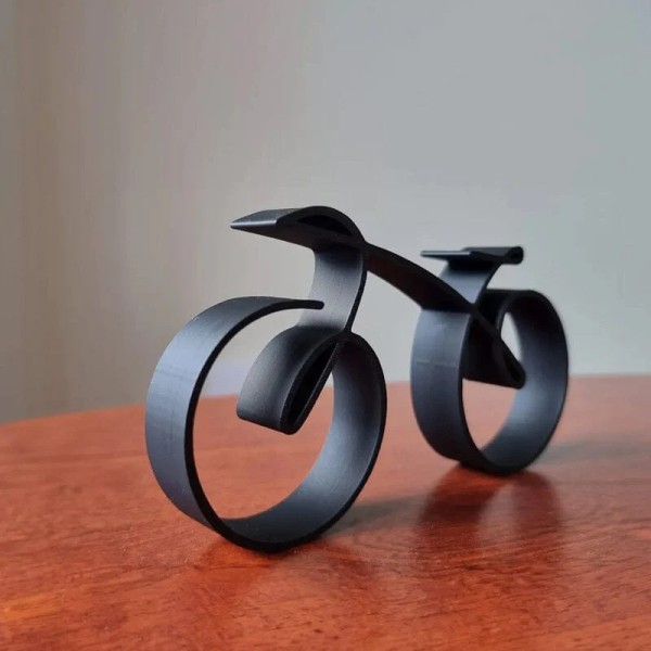 Minimalistisk cykelskulptur, trådramad stil, cykellinje Ar