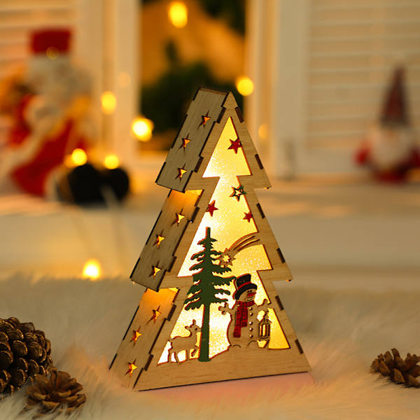 Julgranformade juldekorationer lysande trä natt