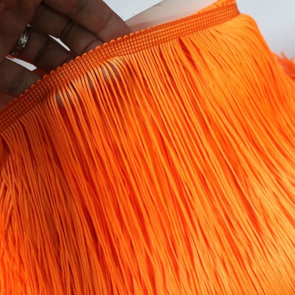 Orange tassel woven polyester sewn satin lace, used in clothing,