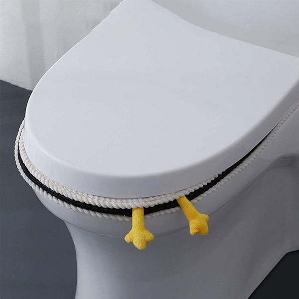Vaaleanpunaiset wc-istuimen pehmusteet, sarjakuva wc-istuimen kannet