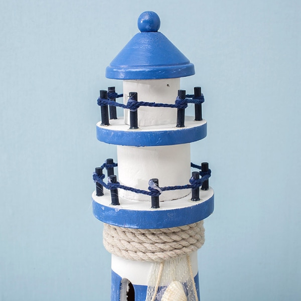 Sinivalkoinen raidallinen suuri peräsinmajakka Ocean Lighthouse W