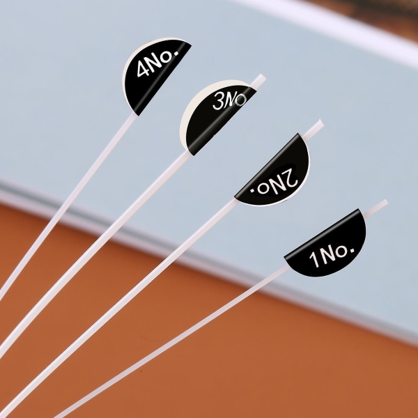 Nylon ukulelesträngar med 4 filtval, strängar är vita, val skickas i slumpmässig färg