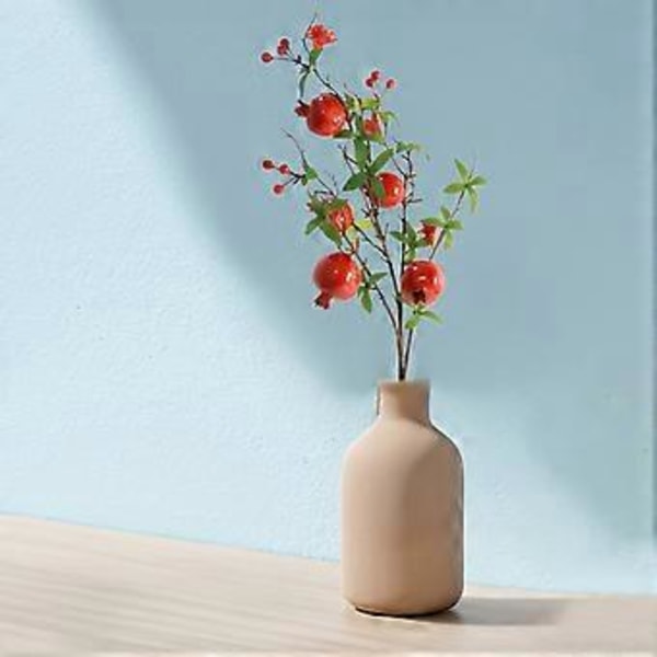 Dekorer stuen med kunstig granatæbleblomstgren