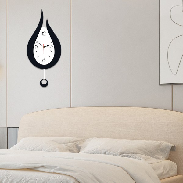 Tyst och dekorativ modern väggklocka med pendel, arabiska num