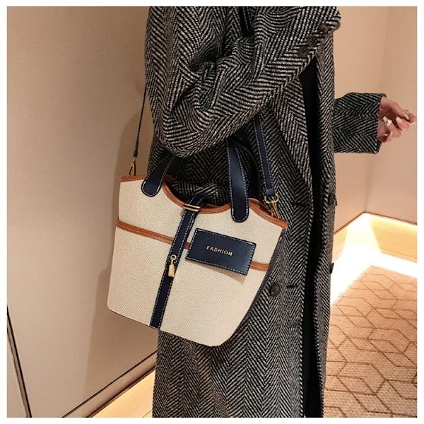 Lille design vintage lærred bærbar spandtaske dame efterår og vinter ins mode kurv messenger taske
