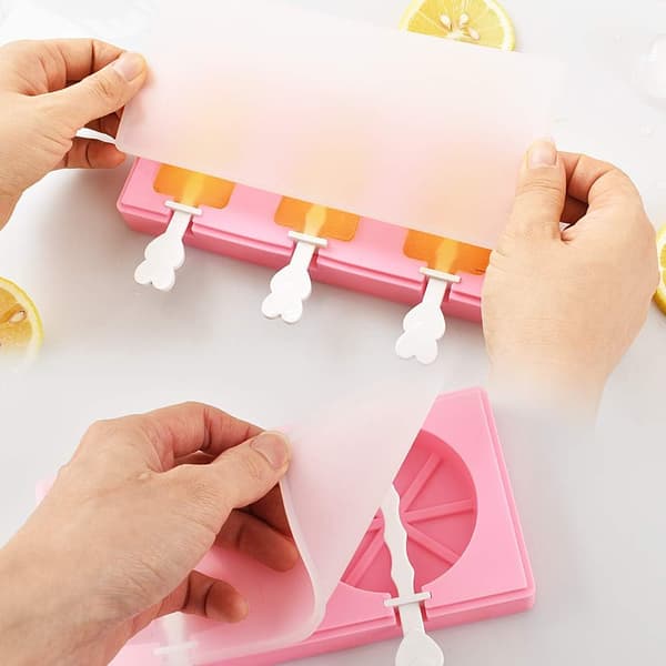 Set med 2 molds med lock och pinnar, klassisk form, vattenmelon, apelsin