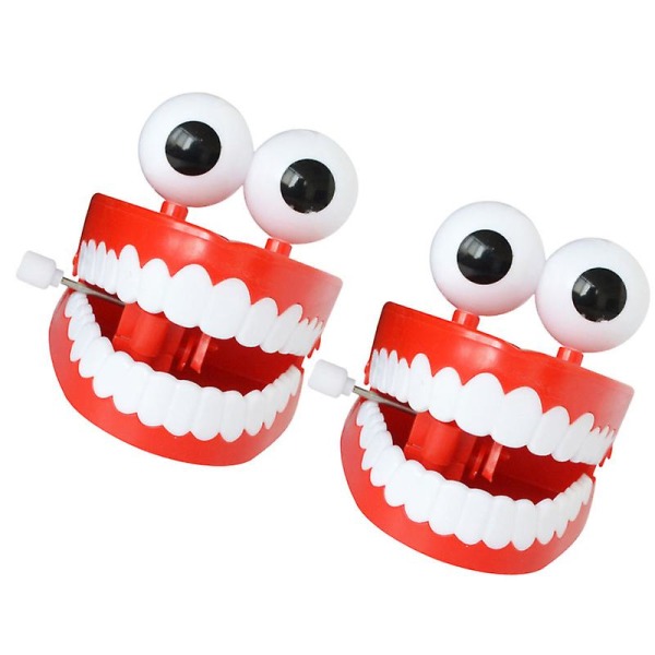 2 nya konstiga leksaker med kedjebandsögon och stora vita tänder